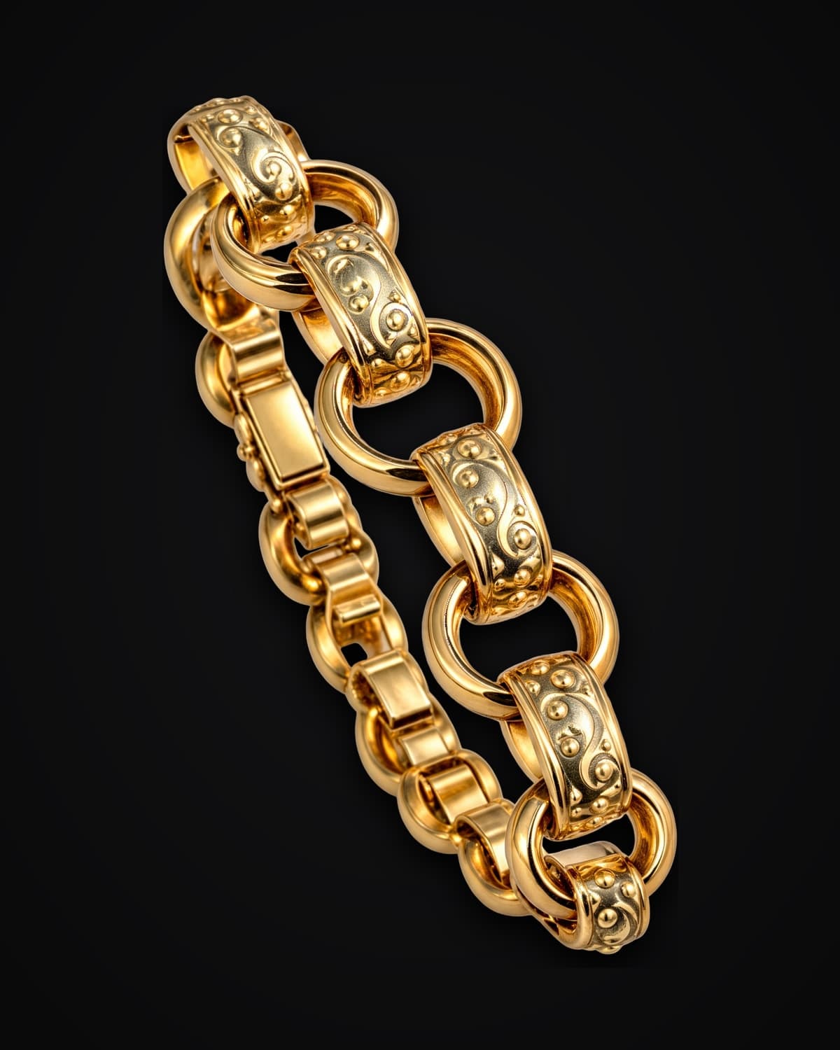 Gold bracelet of alternating round and engraved oval links