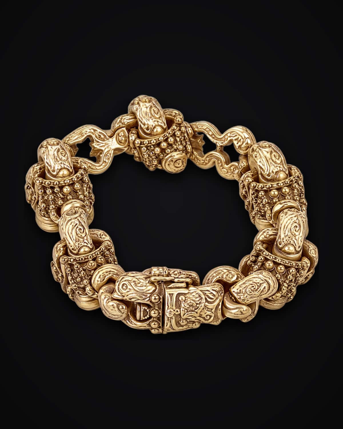 Heavy gold bracelet of engraved links with a box clasp