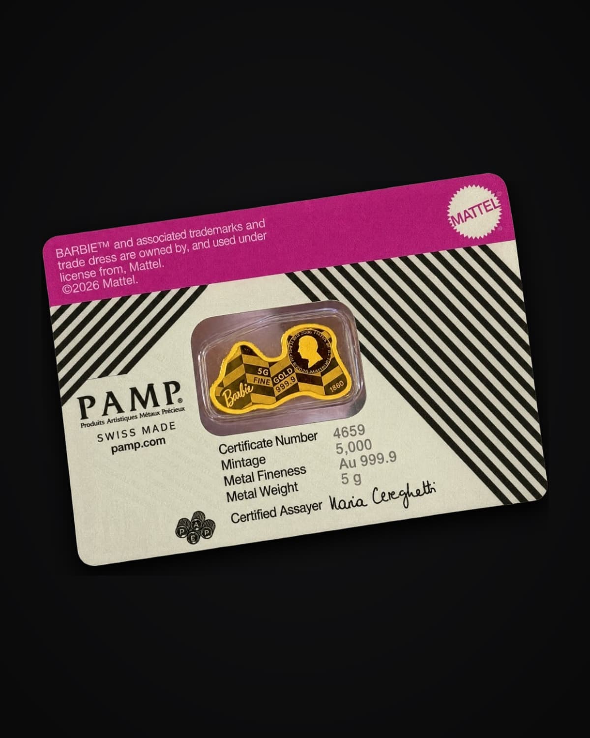 PAMP Barbie gold coin, shaped like the Barbie logo, sealed in its assay card