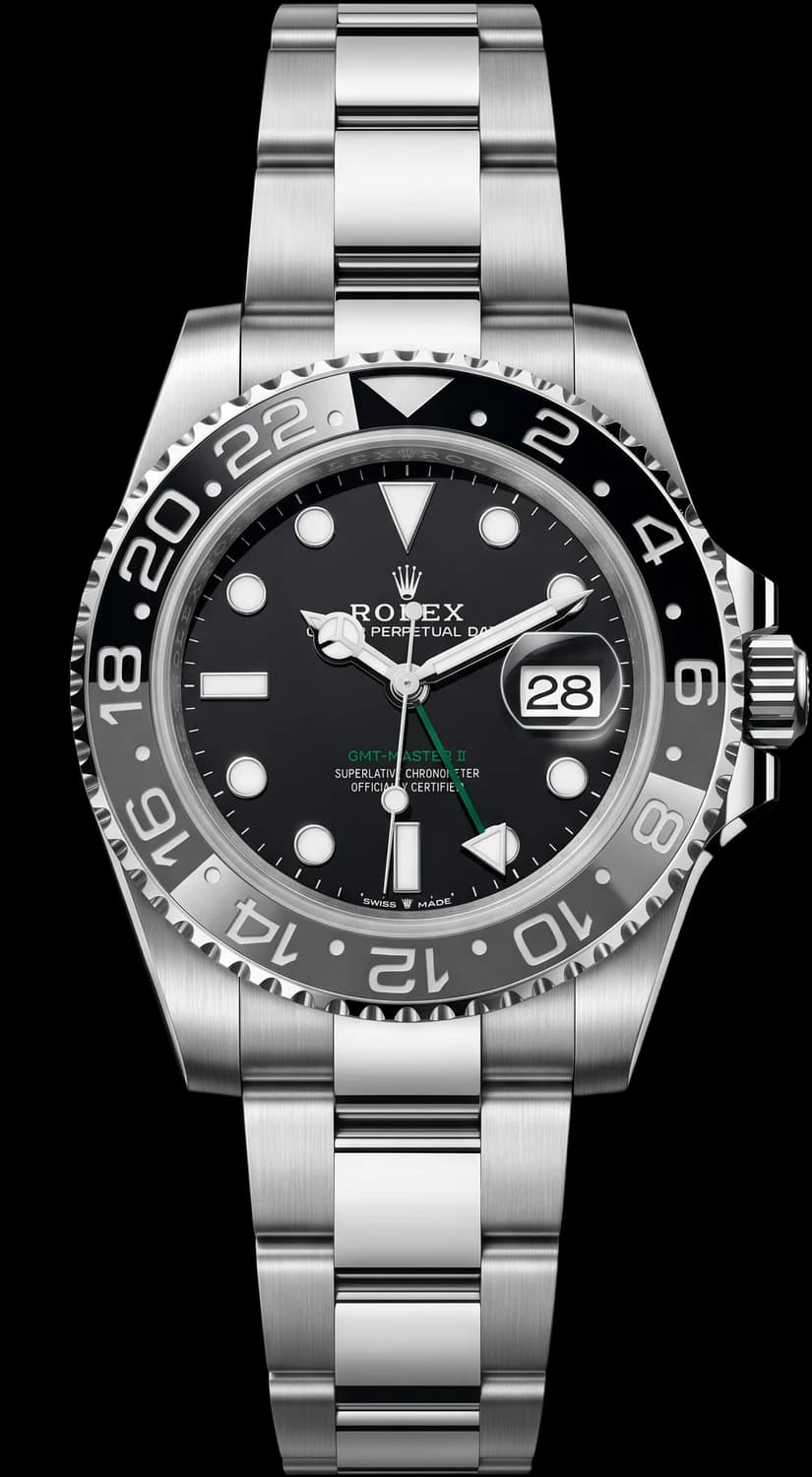 Steel dive watch with a black dial and black bezel on a steel bracelet