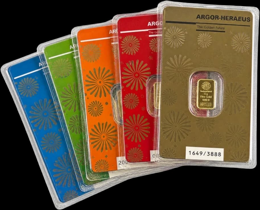 Fan of six coloured collector cards, each with a sealed gold bar