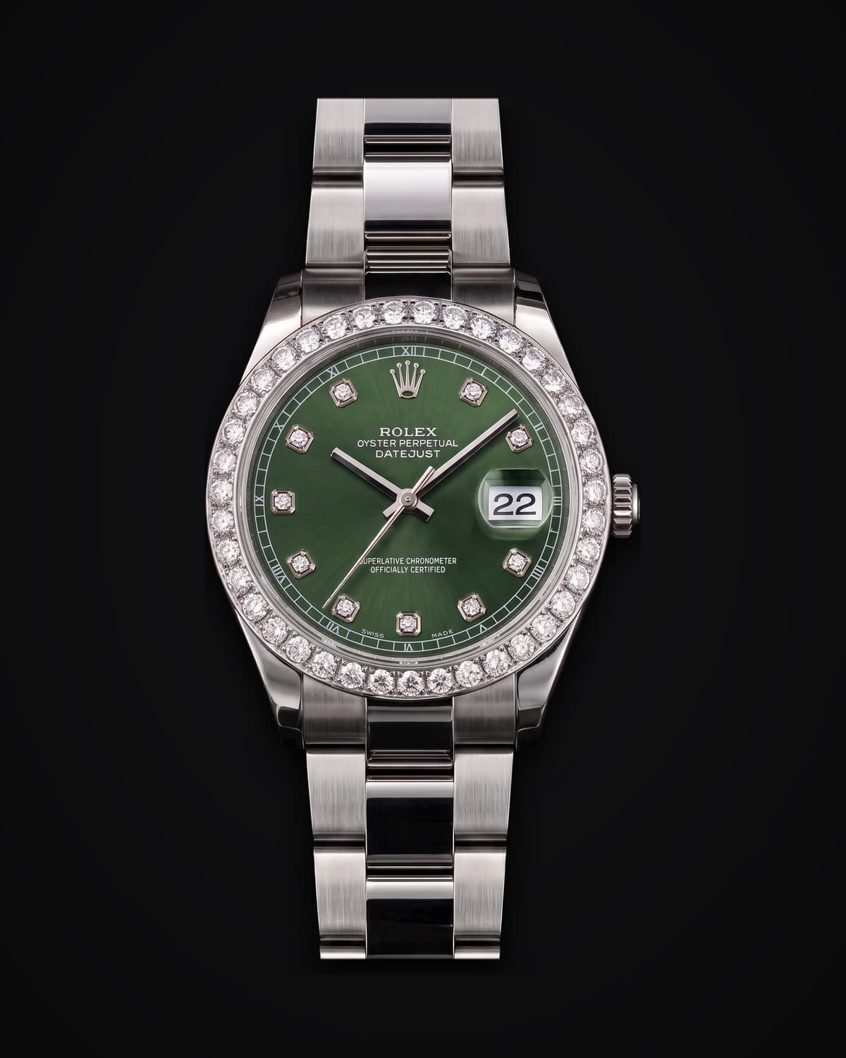 Steel watch with a green dial and diamond-set bezel