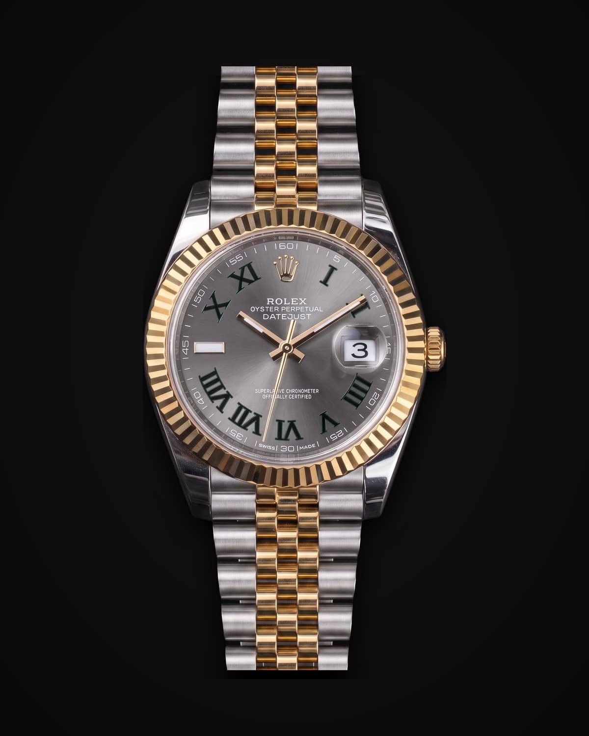 Steel and yellow gold watch with a slate dial, green Roman numerals and a Jubilee bracelet